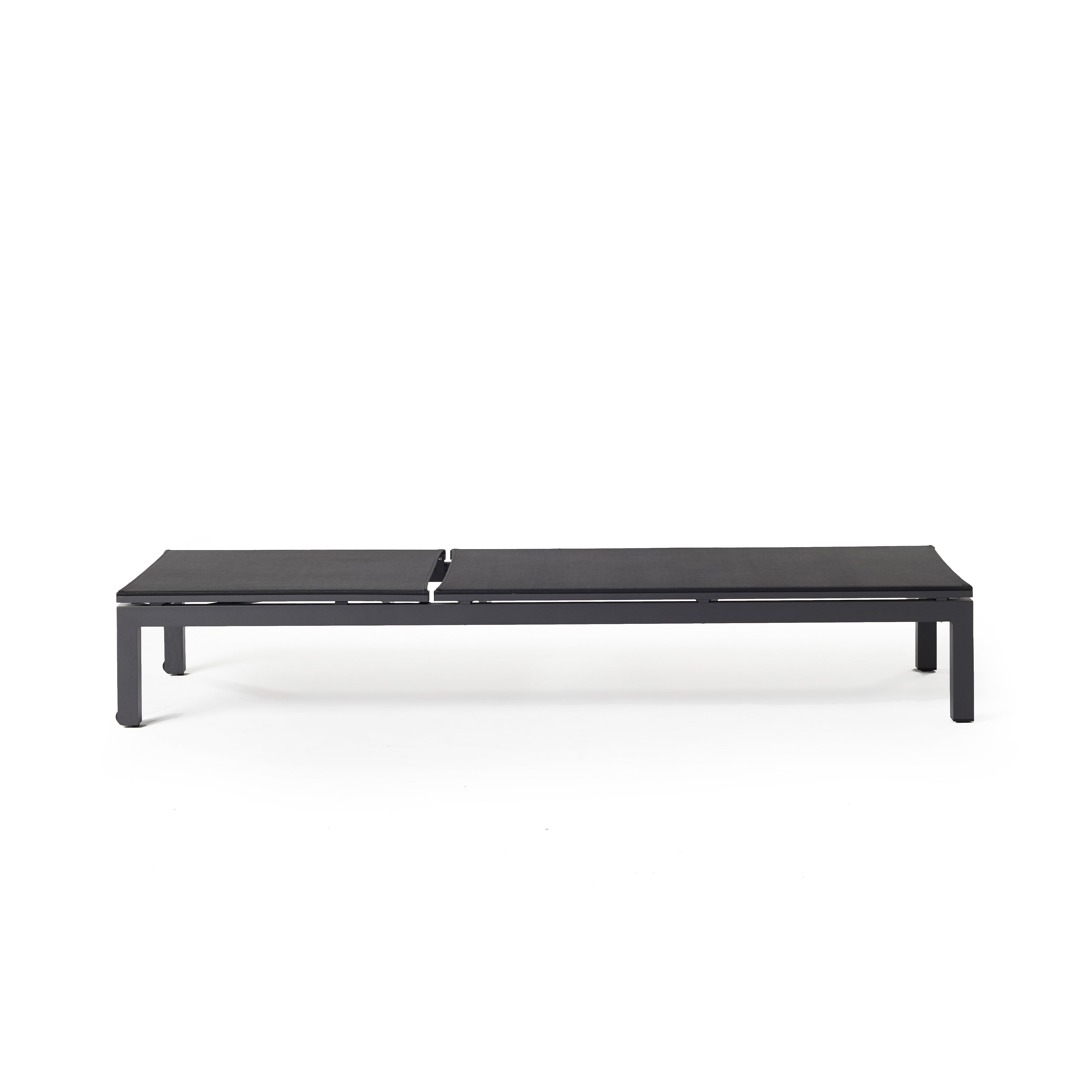 Belvedere Chaise by Terra Outdoor Living, featuring a sleek aluminum frames and Textilene sling fabric that resists tears, retains shape, and dries quickly. This chaise reclines to 5 positions, including fully flat, with hidden wheels for easy maneuvering, offering comfort and durability for years of outdoor relaxation. Shown fully flat.