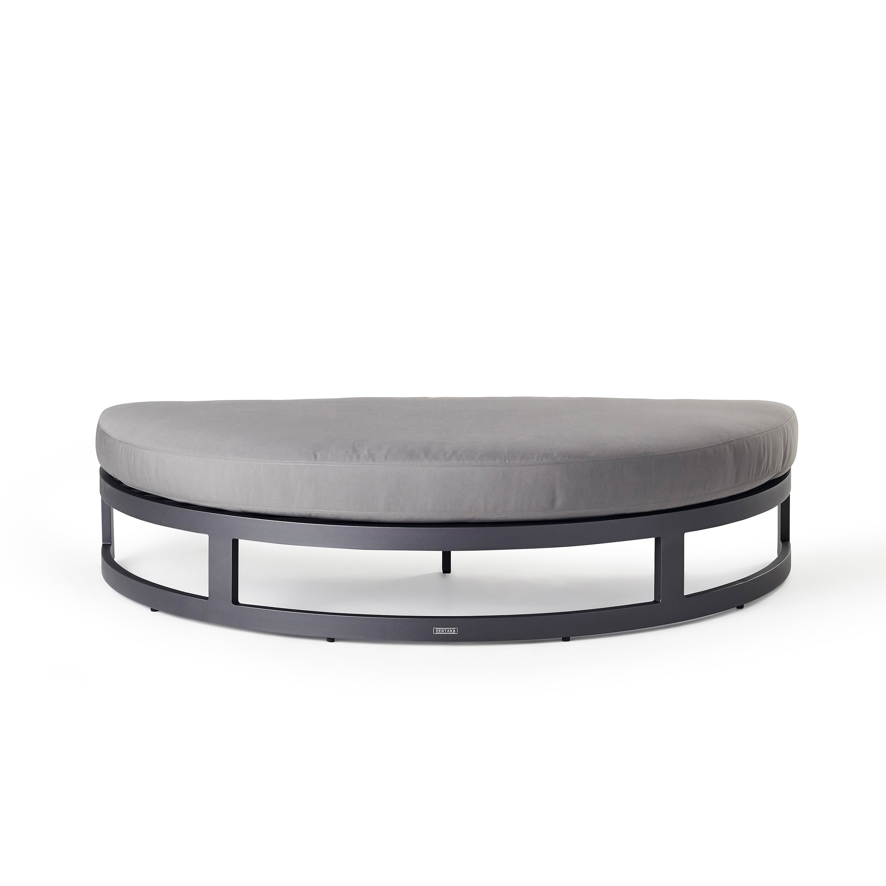 Belvedere Daybed Ottoman by Terra Outdoor Living, crafted from durably finished aluminum with thick Sunbrella® cushions, features a modular design with a separate backrest and ottoman for customizable comfort and versatility. Ottoman is half-moon shaped, with straight side to fit against the back part of the configuration.