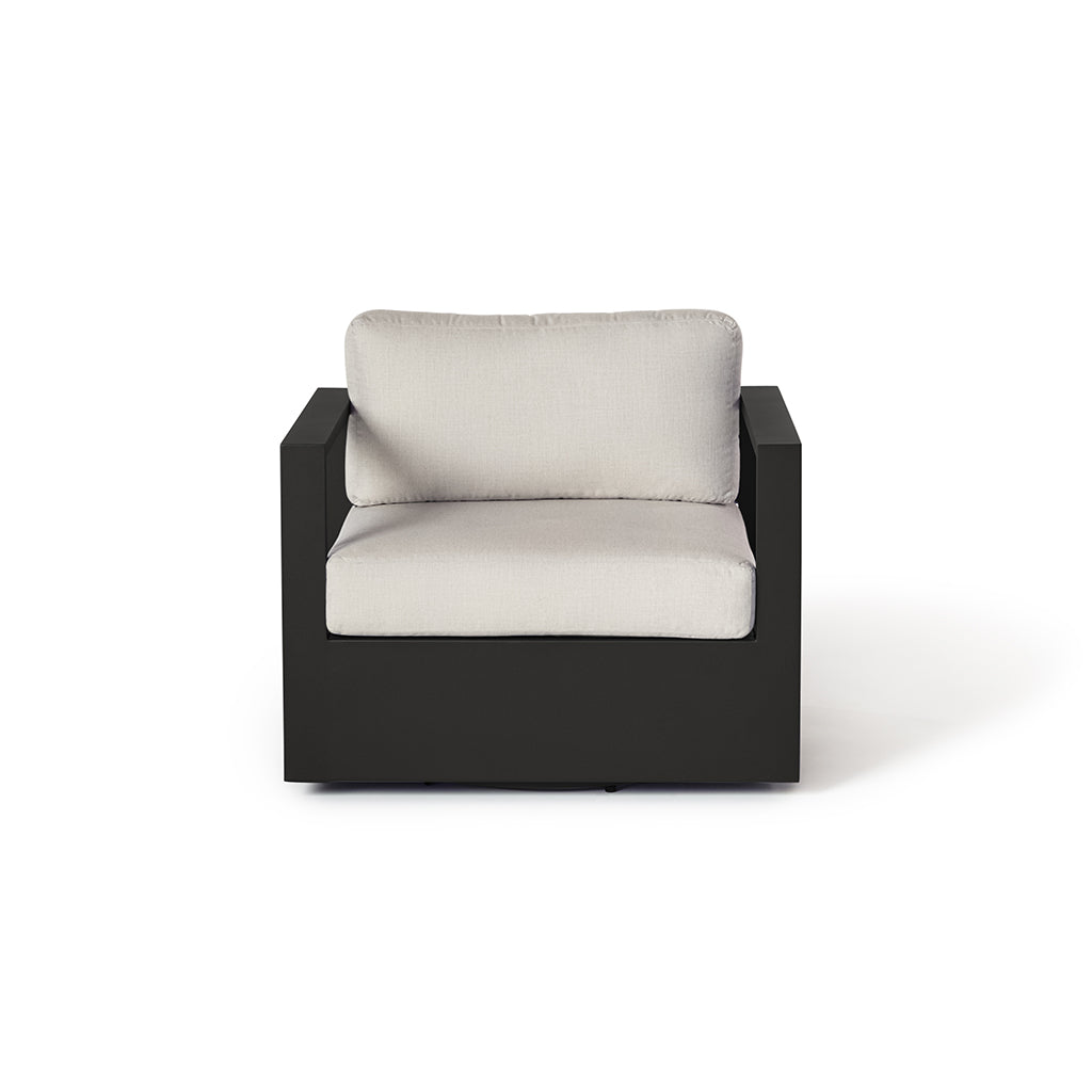 Belvedere Swivel Lounge Chair by Terra Outdoor Living, featuring a architectural charcoal aluminum frame with a durable swiveling base and thick cushions, designed for deep comfort and effortless relaxation in an airy, modern style.
