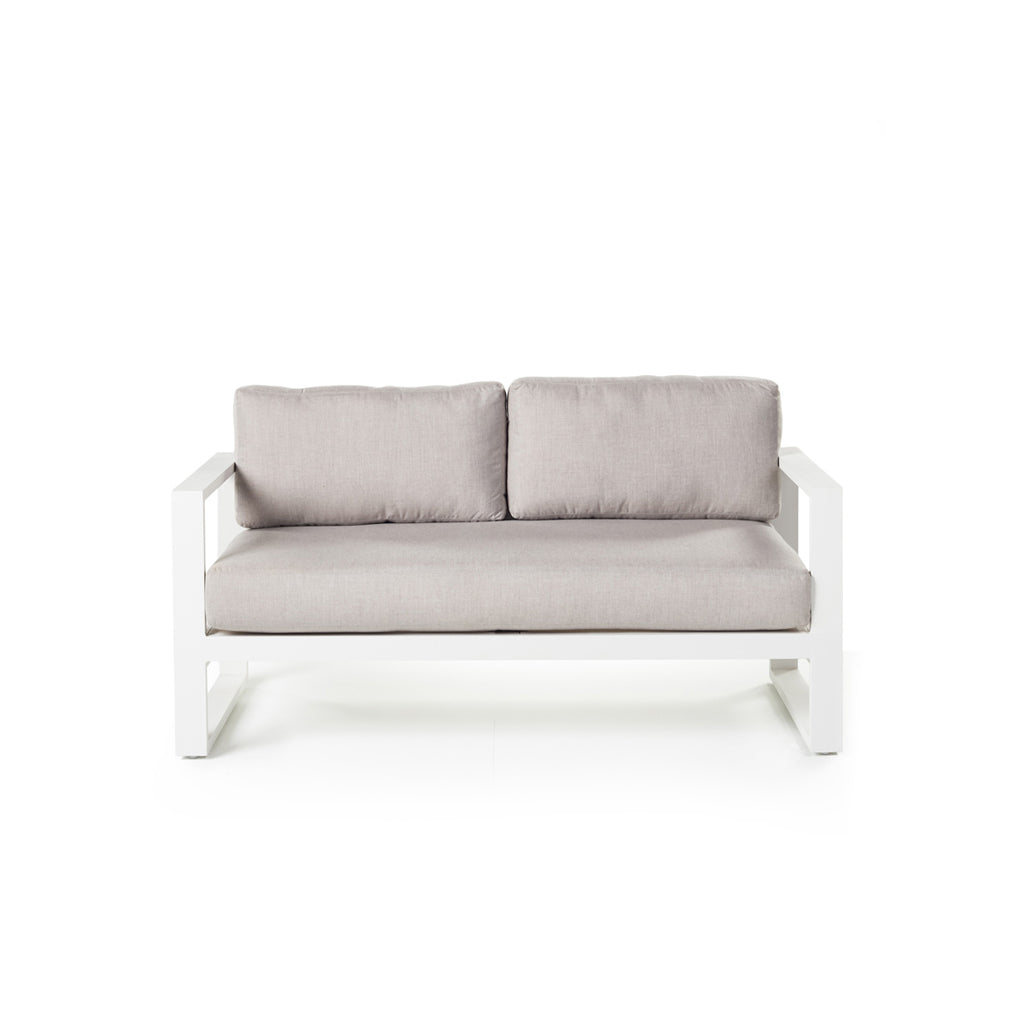 Belvedere Loveseat in Charcoal by Terra Outdoor Living features architectural lines, airy proportions, and deep weather-friendly cushions on a low-profile, durably finished aluminum frame with slatted detailing for drainage. Features squared-off arms wide enough to rest a drink on. One long seat cushion plus two back cushions complete a clean look.