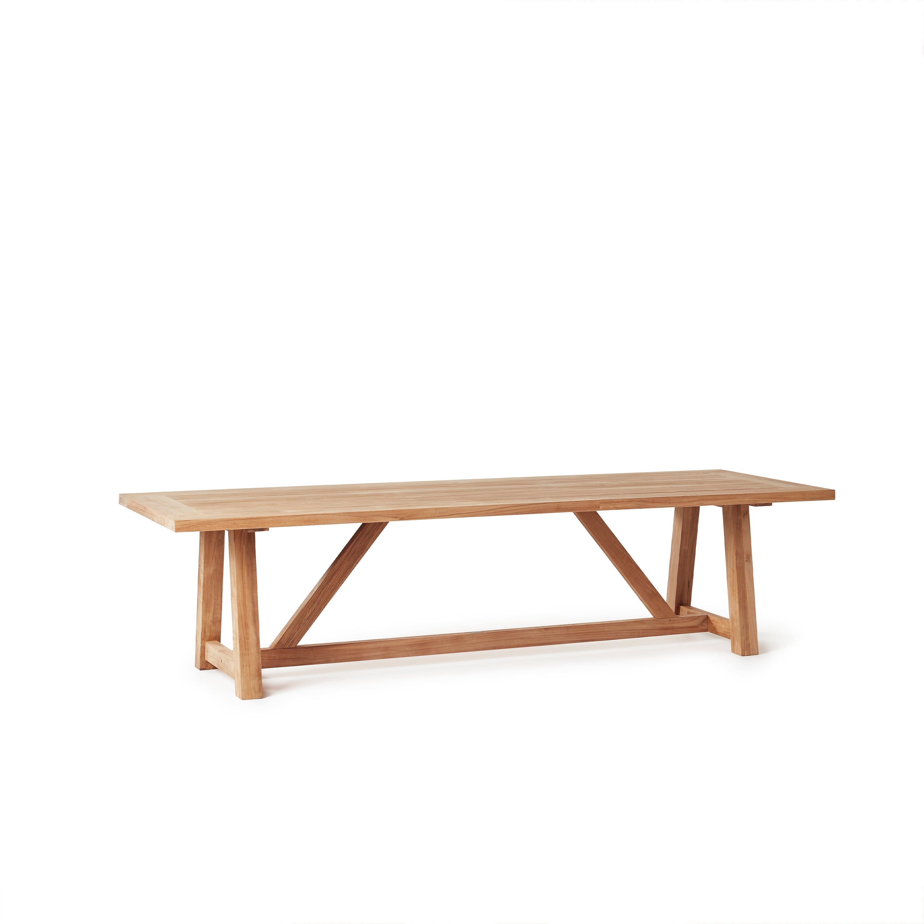 Madera 118" Vintage Beam Table by Terra Outdoor Living is a trestle style dining table with a slatted top. The slats are narrow and elegant. The entire table is made from premium teak in a natural finish. Seats 12.