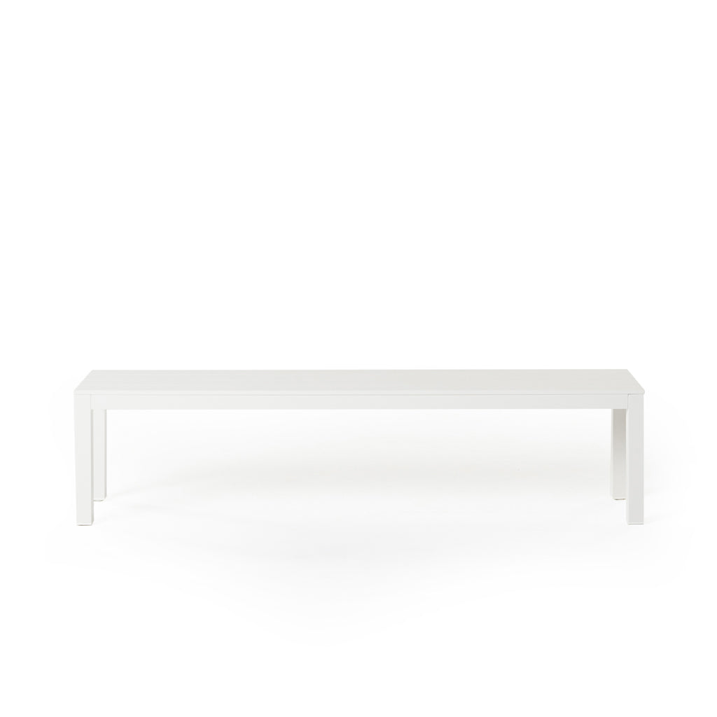 Belvedere Backless Dining Bench in White by Terra Outdoor Living, crafted from durable aluminum with a modern, streamlined slatted design, featuring clean architectural lines and an airy silhouette for versatile outdoor seating.