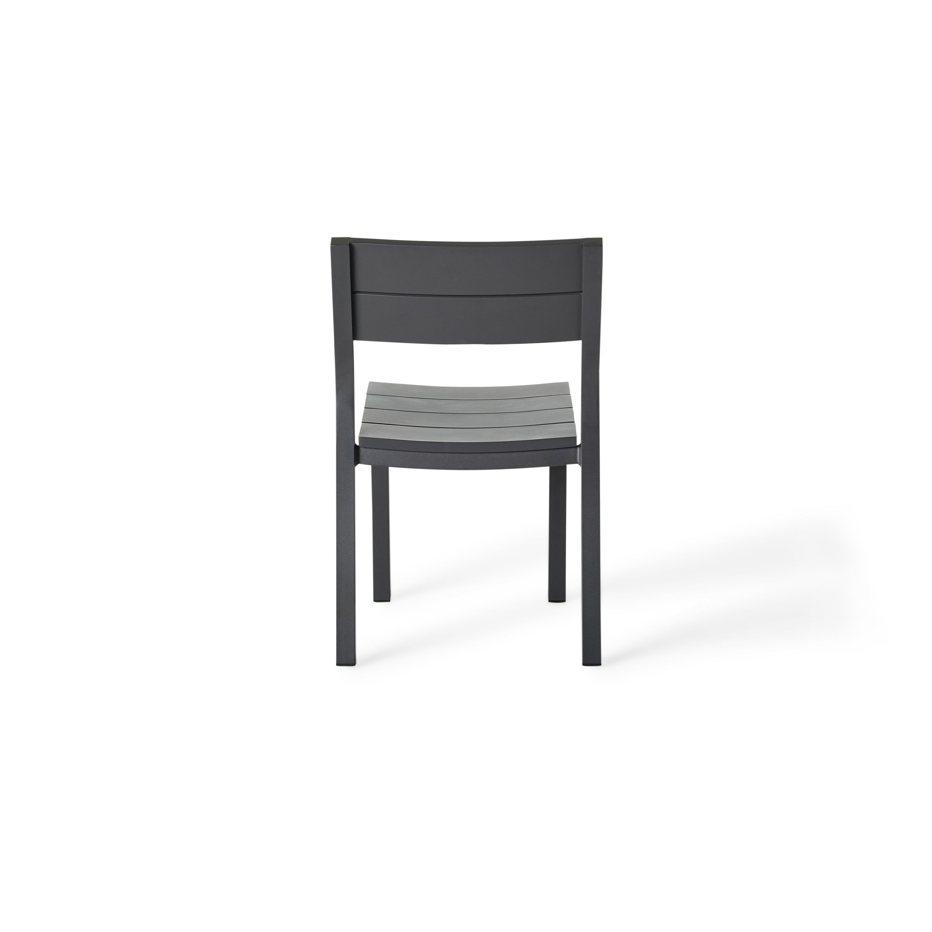 Belvedere Dining Side Chair in Charcoal by Terra Outdoor Living combines expertly crafted aluminum and durable finishes with a slightly scooped seat and flared back for enhanced comfort, plus a stackable design for easy, compact storage.