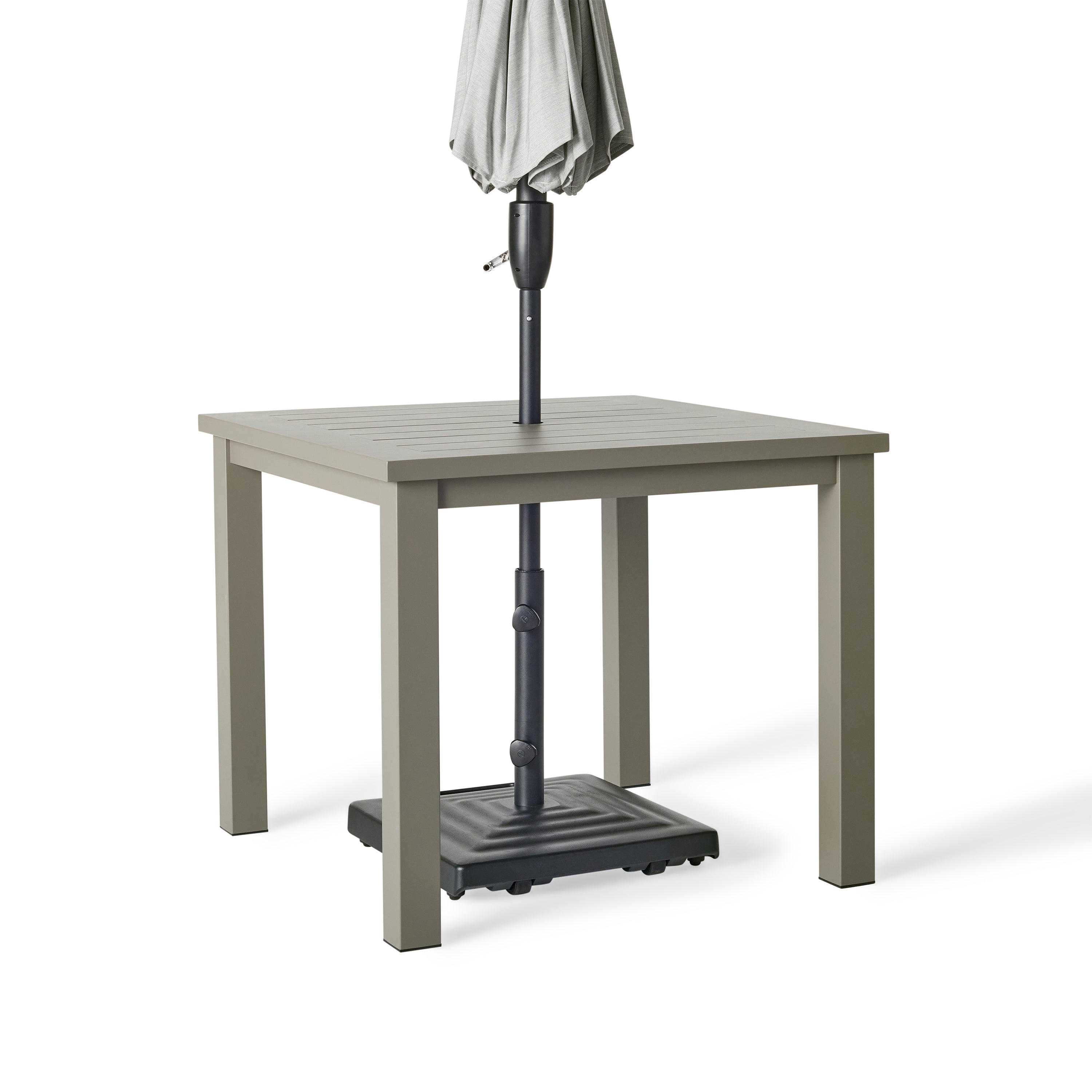 Belvedere Square Dining Table by Terra Outdoor Living in Quartz Grey, a warm grey tone, shown with a slatted aluminum top and central umbrella hole, featuring a clean-lined, modern silhouette in a compact size for versatile outdoor placement. Shown with umbrella fitted through hole to demonstrate functionality.