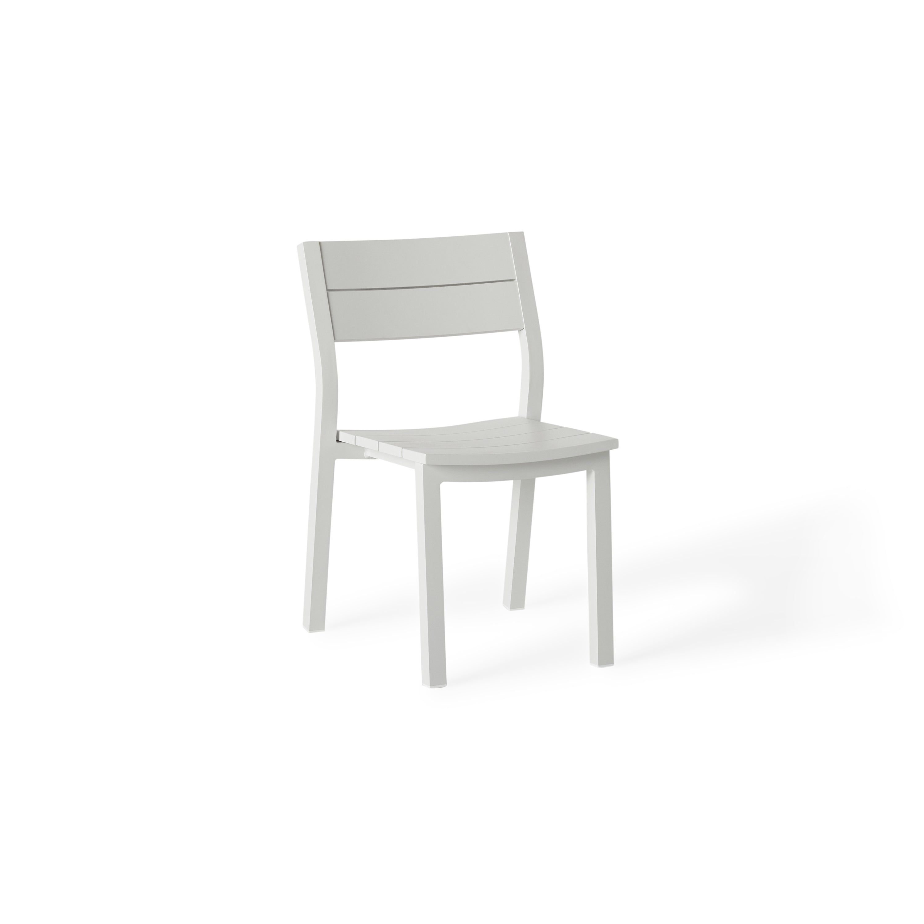 Belvedere Side Chair by Terra Outdoor Living, featuring a sleek white aluminum frame with a slightly scooped seat and flared back, shown in a modern, airy silhouette designed for comfort and easy stacking.