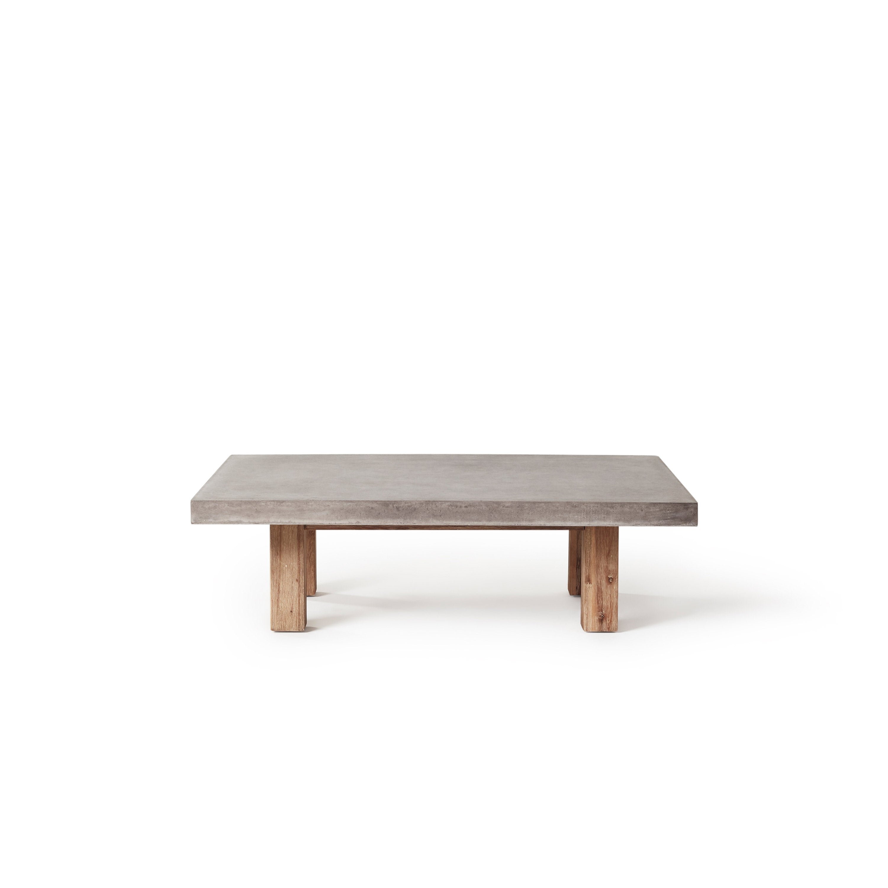The 48" Bordeaux Coffee Table by Terra Outdoor Living pairs rustic acacia wood legs with tops crafted from a composite concrete that delivers a modern industrial look and feel at a fraction of the weight.