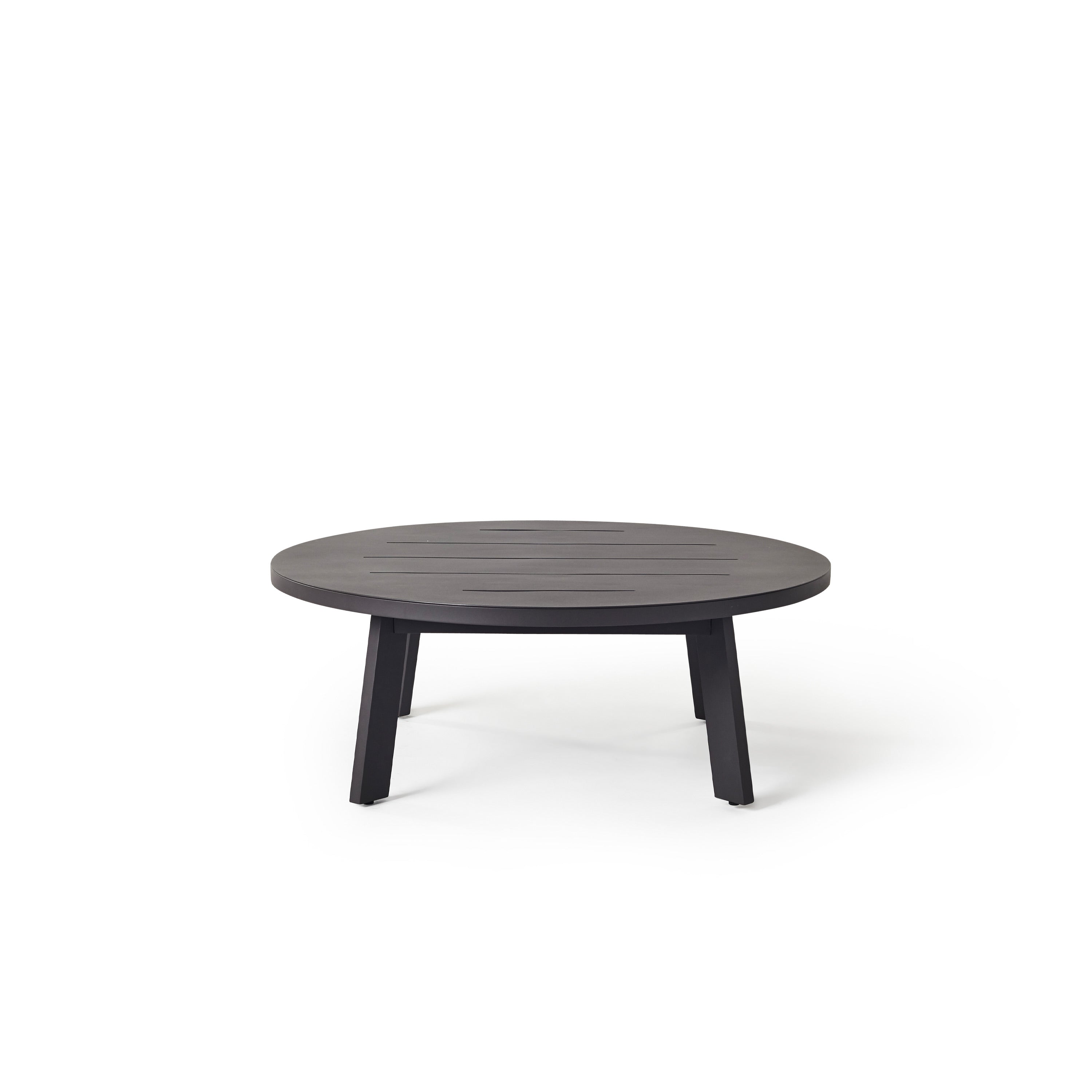 The Cavallo 43" Round Coffee table in Charcoal Aluminum by Terra Outdoor Living is a sleek all-aluminum coffee table, with a round slatted top atop 4 subtly angled straight-edged legs.
