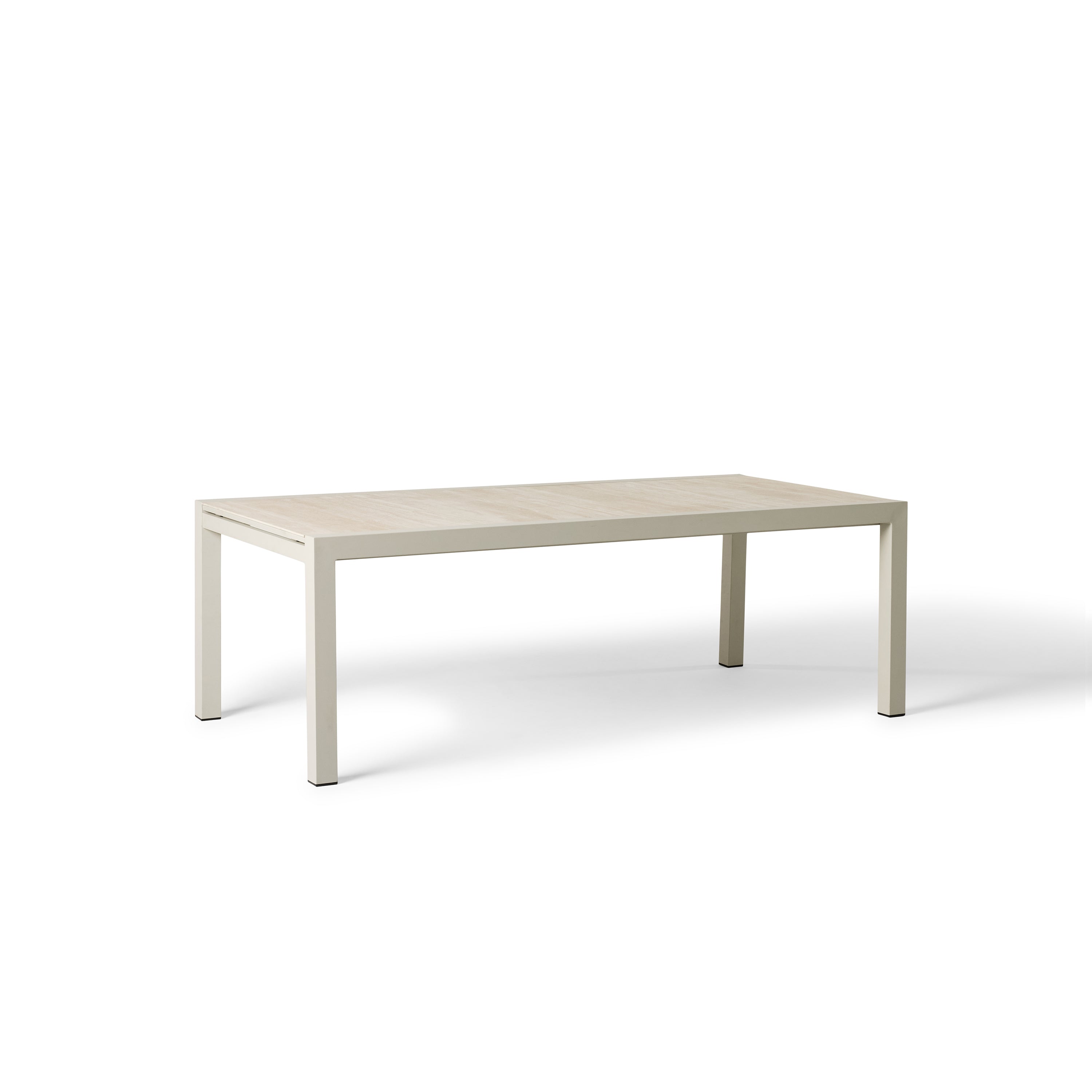 Del Mar Dining Table by Terra Outdoor Living — features an aluminum frame in 'Dune' with a ceramic top; seats up to 12 comfortably and includes a convenient extendable leaf that nests under the table when not in use, perfect for dining and entertaining.