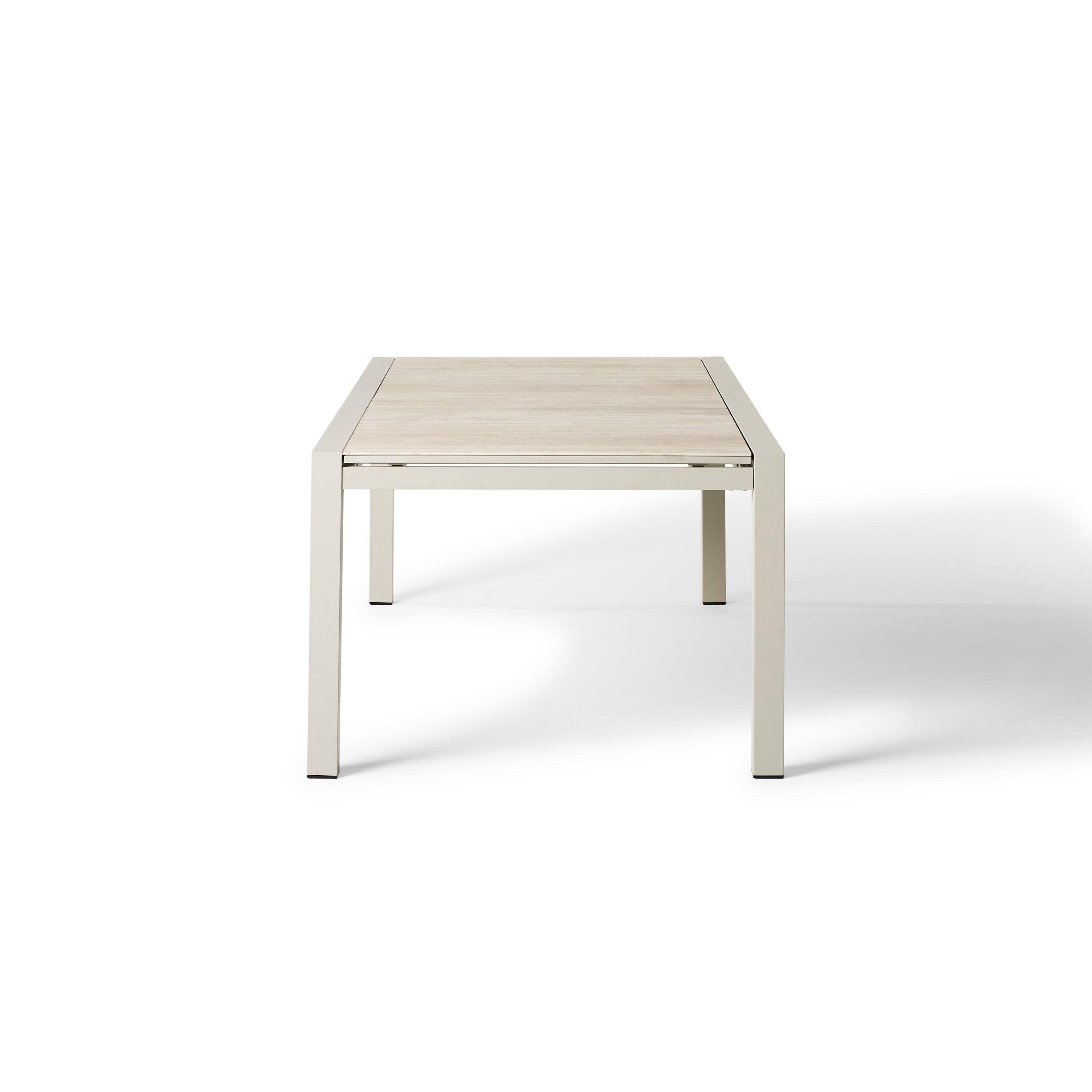 Del Mar Dining Table by Terra Outdoor Living — features an aluminum frame in 'Dune' with a ceramic top; seats up to 12 comfortably and includes a convenient extendable leaf that nests under the table when not in use, perfect for dining and entertaining.