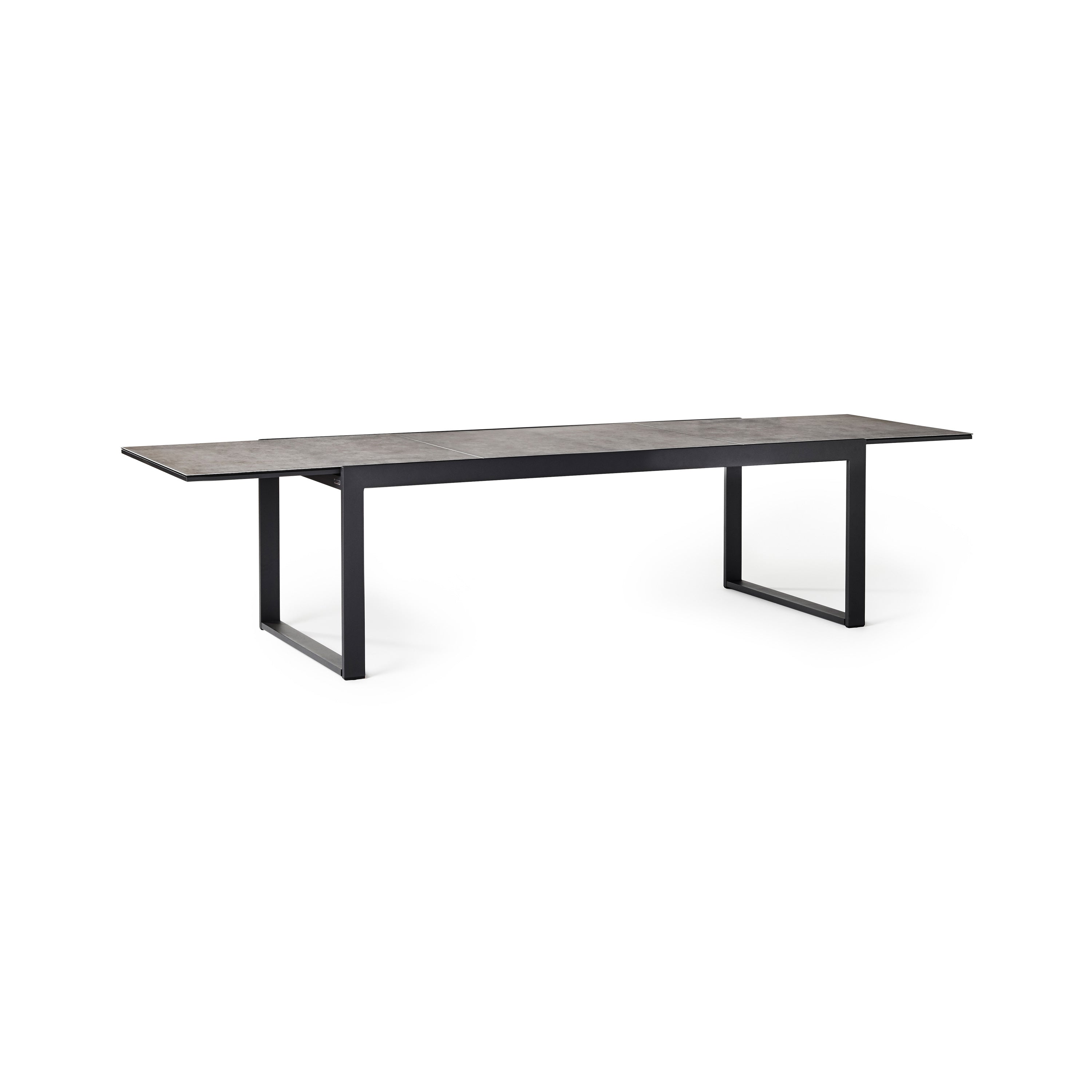 Diablo 87"-130" Extension Dining Table in Charcoal by Terra Outdoor Living is an extension dining table, with sled-style powdercoated aluminum frame and 'ceramic' coated tempered safety glass as the table top. It has a sleek modern look and can extend to suit the moment.