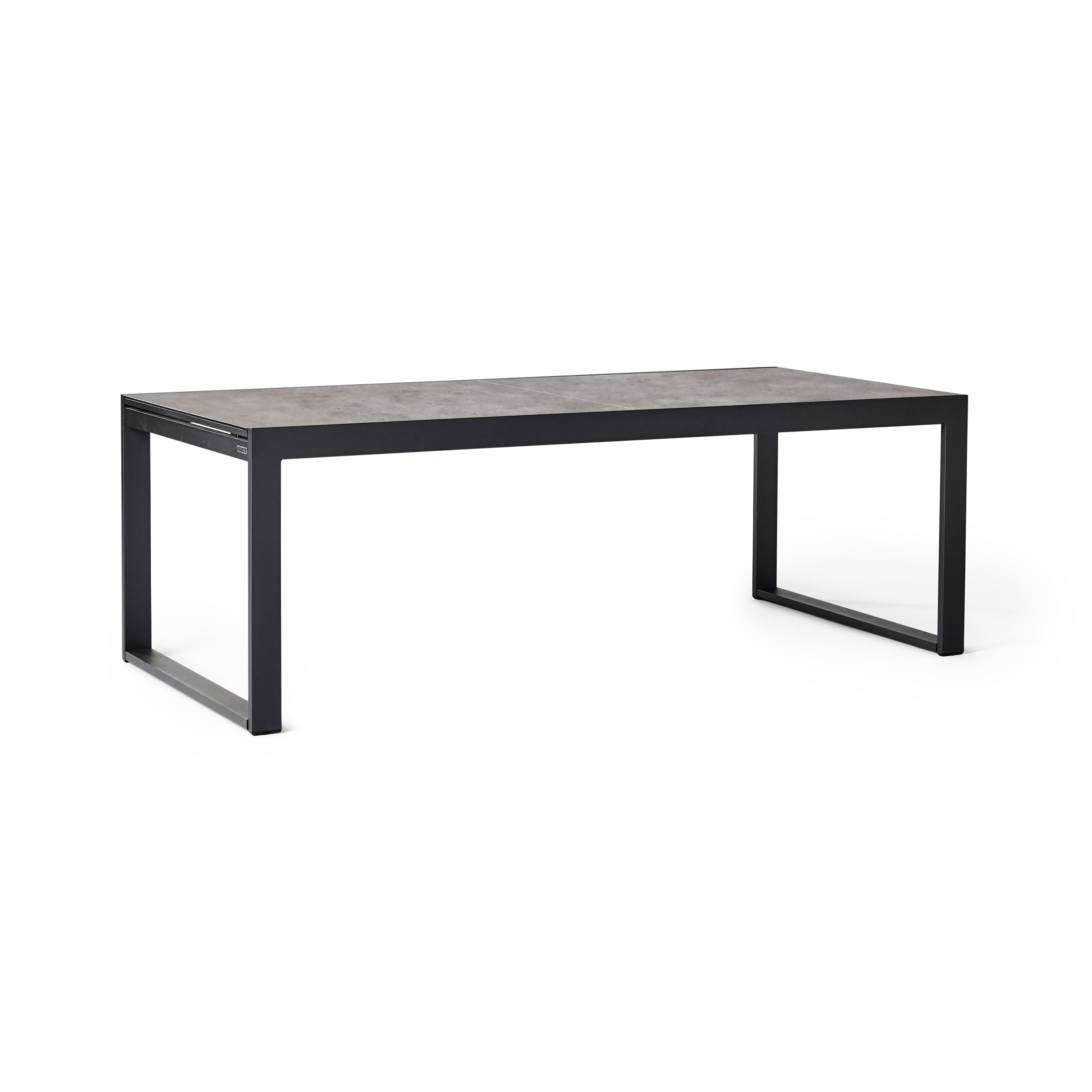 Diablo 87"-130" Extension Dining Table in Charcoal by Terra Outdoor Living is an extension dining table, with sled-style powdercoated aluminum frame and 'ceramic' coated tempered safety glass as the table top. It has a sleek modern look and can extend to suit the moment. Image shows table un-extended.