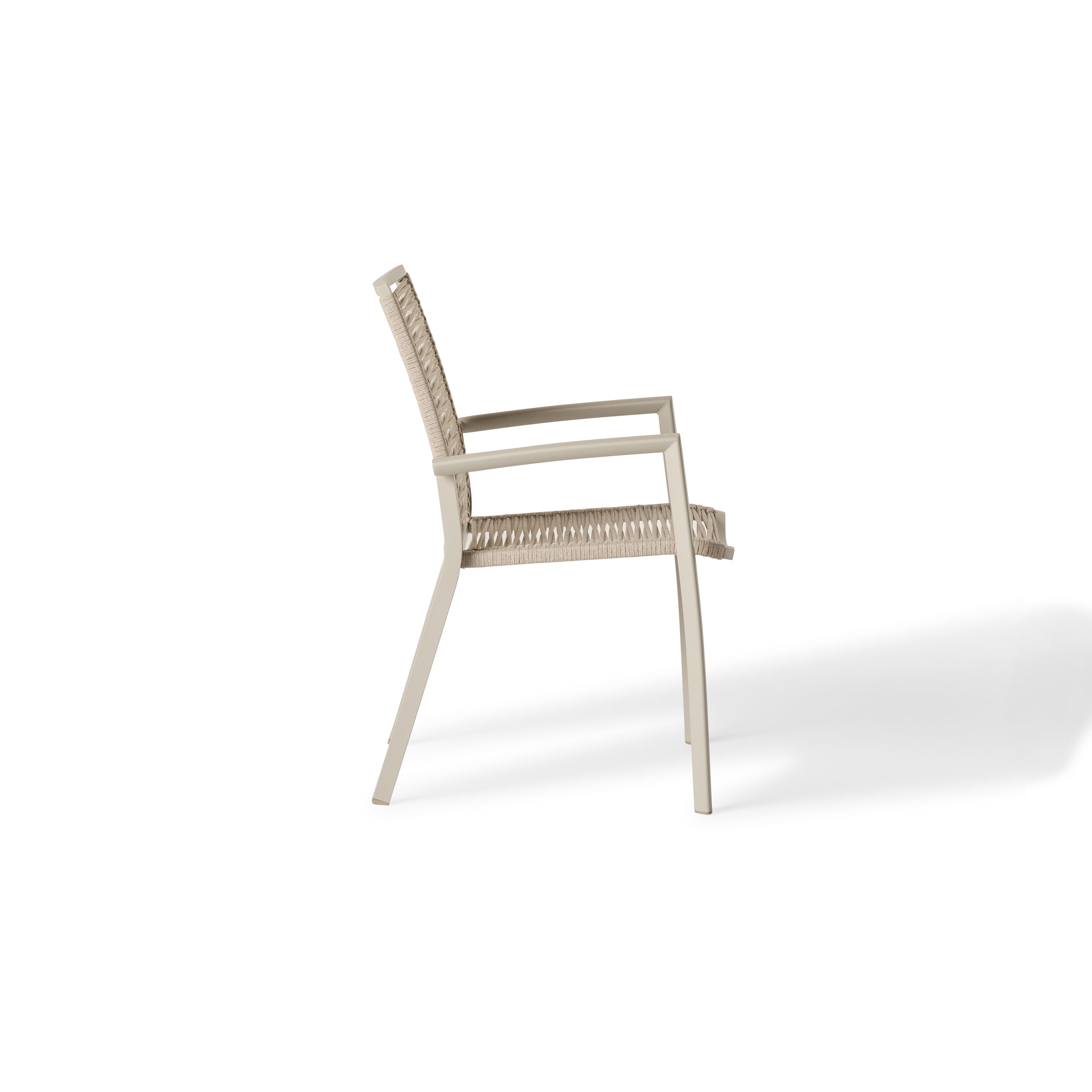 The Diablo Dining Arm Chair in Dune by Terra Outdoor Living features squared off clean lines and rope wrapping for the seat and back. It has straight arms for support, and subtly scooped seat and back for ergonomics.
