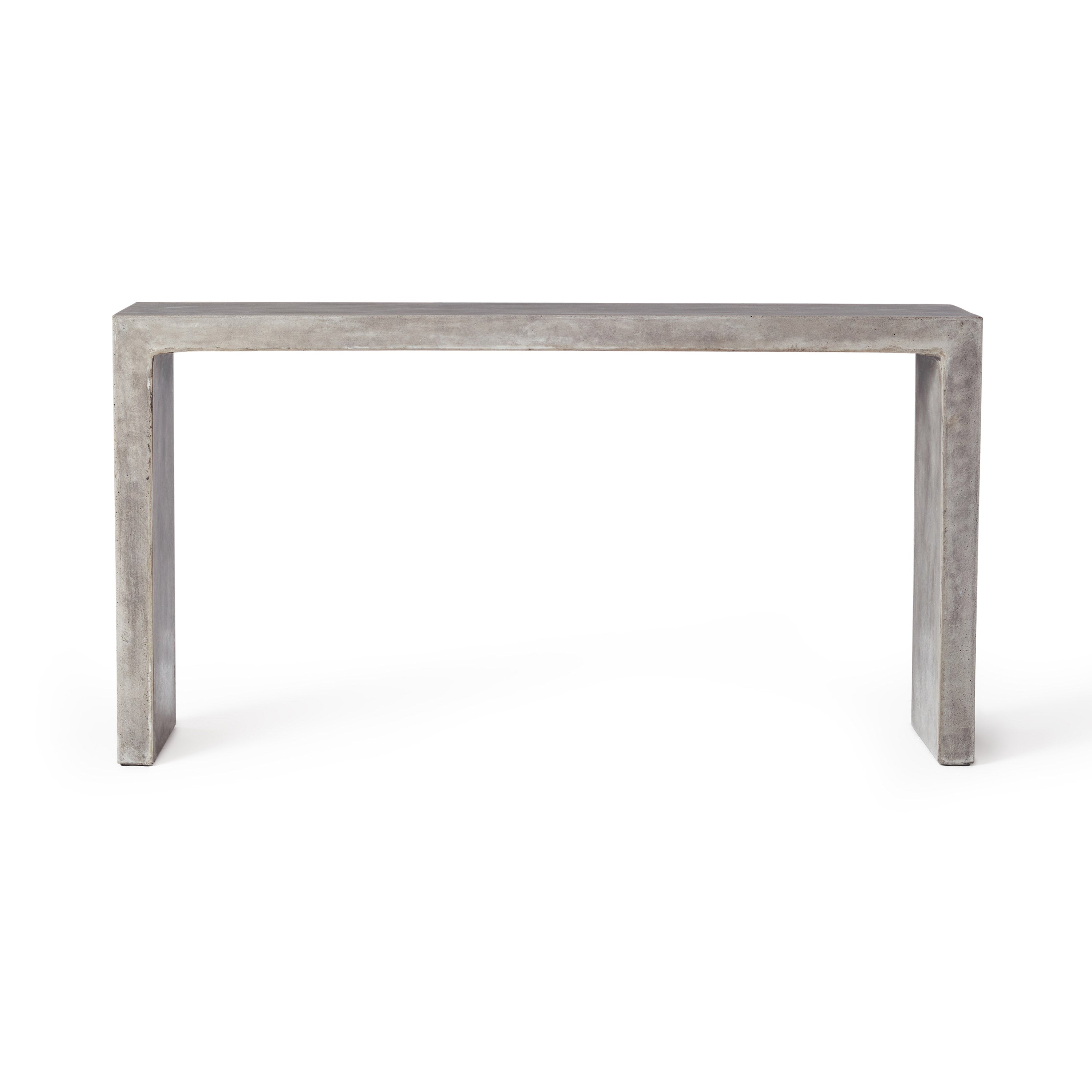 The Mason Console Table by Terra Outdoor Living is made entirely from Glass Fiber Reinforced Concrete (GFRC) and its surface effect resembles that of industrial concrete. The console table sits at a height above dining, but below bar.
