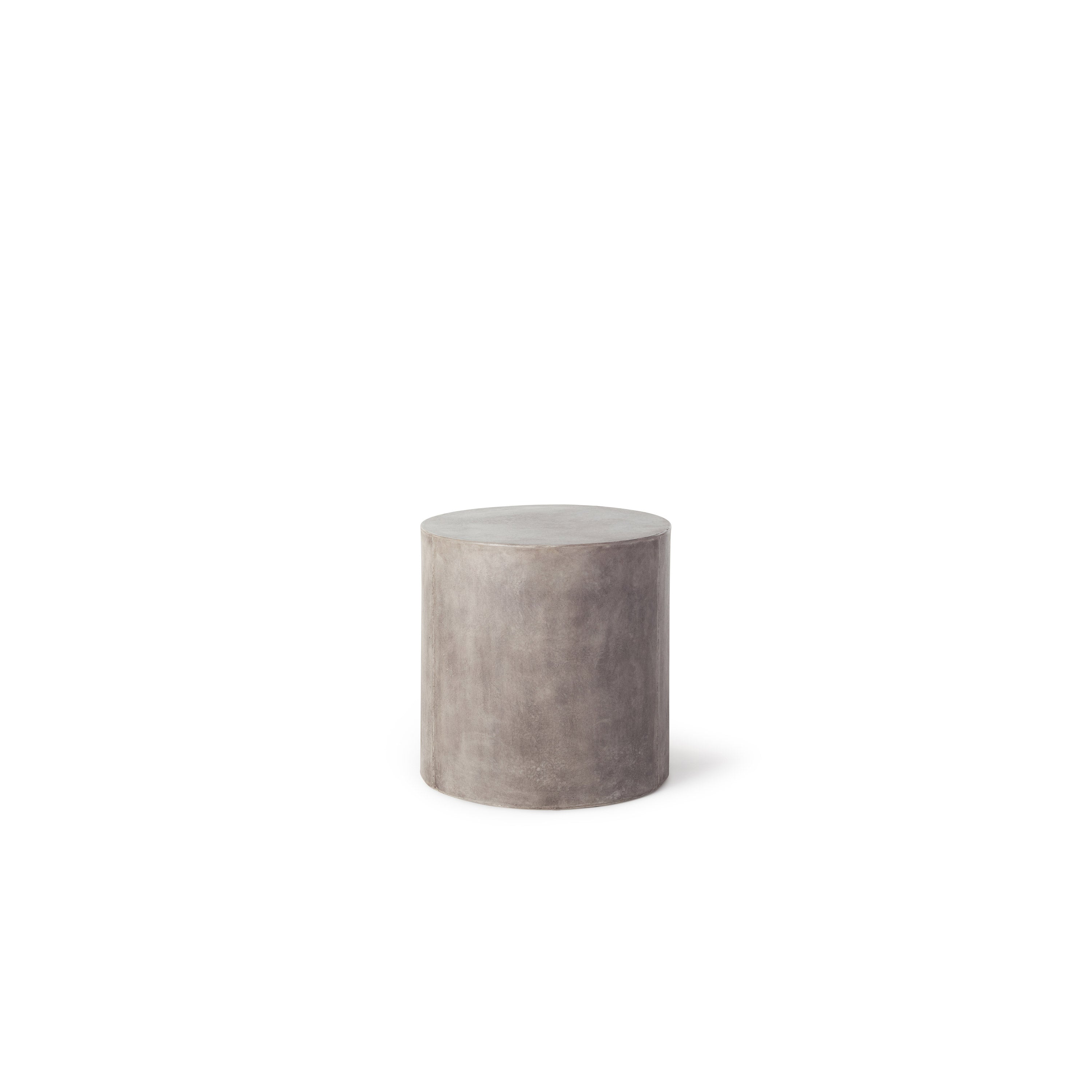The Mason Round Side Table by Terra Outdoor Living is a concrete cylinder, made of Glass Fiber Reinforced Concrete. It has a flat top, and the surface effect resembles industrial concrete.