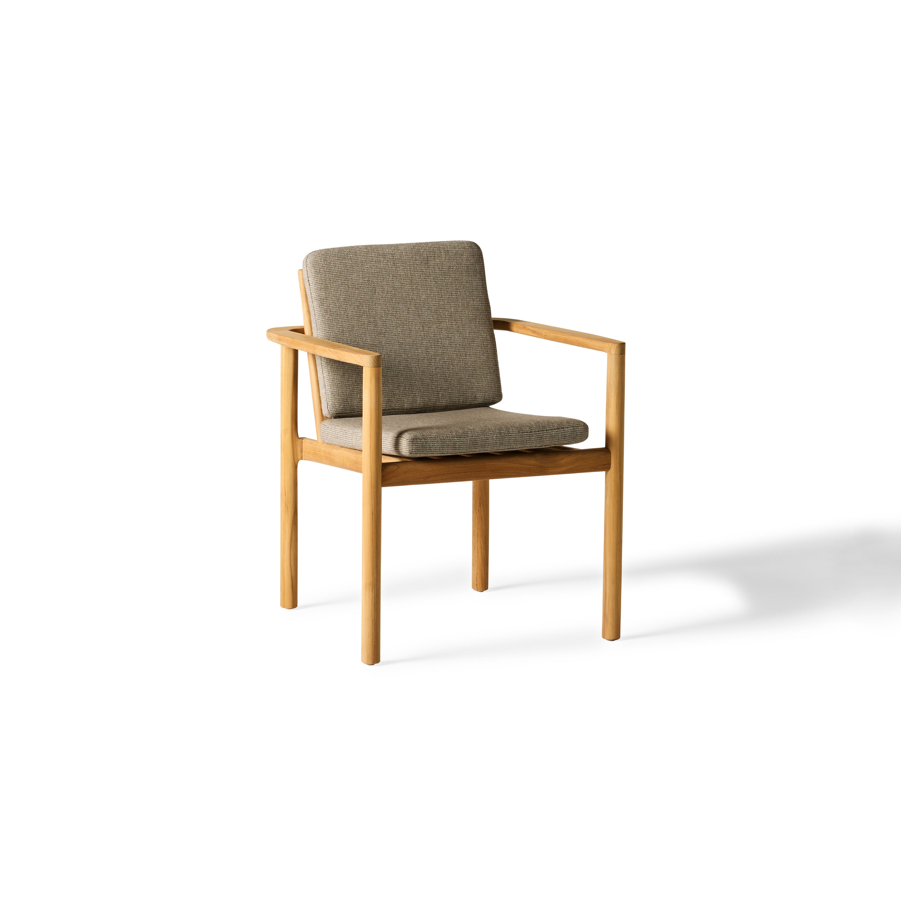 Stinson Dining Chair with teak frame and Italian rope seat back, featuring softly curved lines and vertical slats for a wraparound silhouette; includes one cushioned seat and back, all in weather-friendly materials for outdoor comfort and durability.