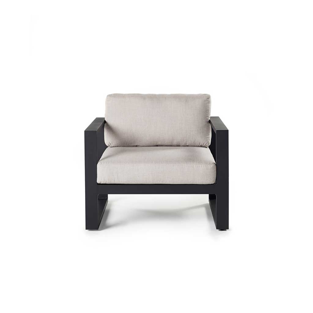 Belvedere Lounge Chair in Charcoal by Terra Outdoor Living features architectural lines, airy proportions, and deep weather-friendly cushions on a low-profile, durably finished aluminum frame with slatted detailing for drainage—designed for relaxed outdoor living. Features squared-off arms wide enough to rest a drink on.