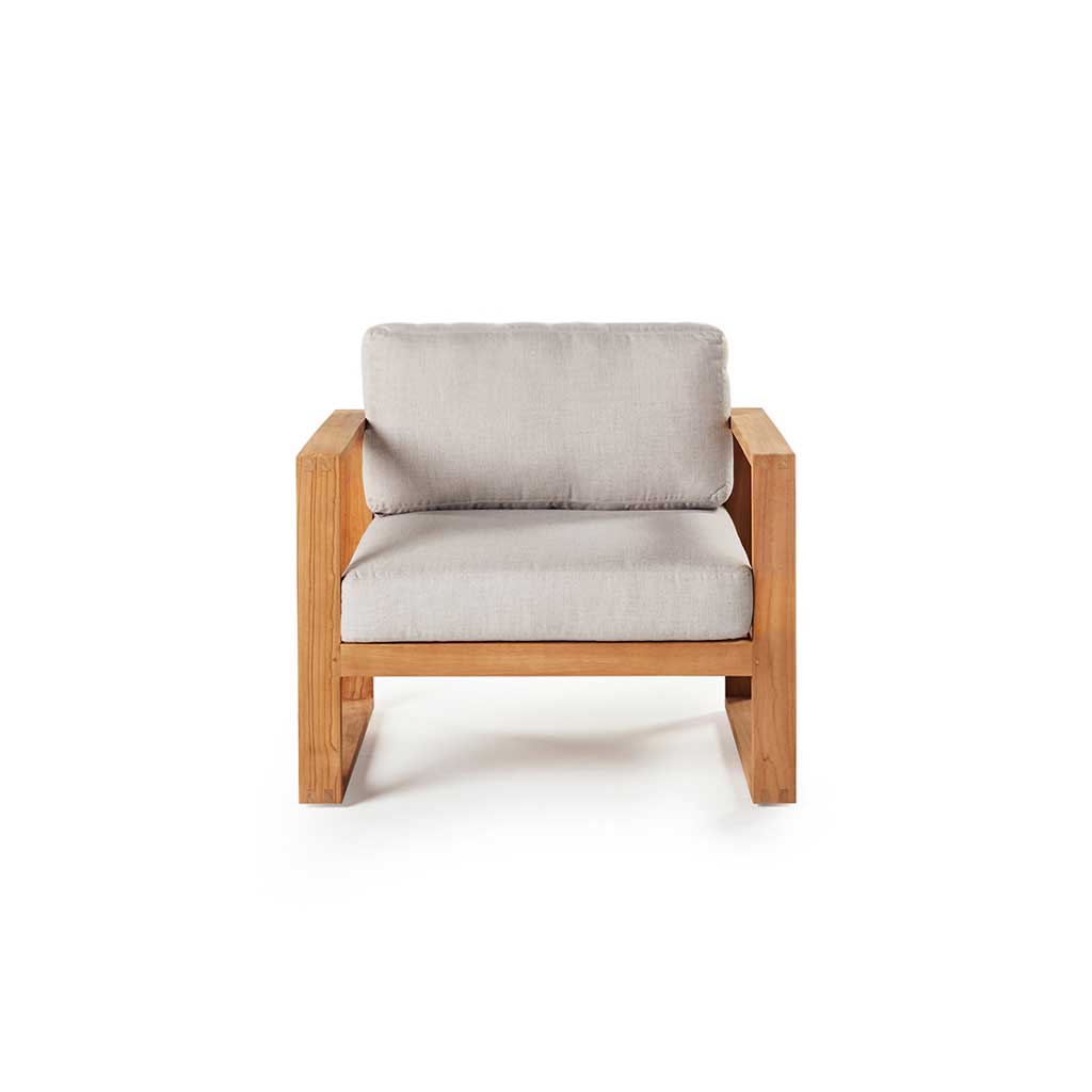 Belvedere Lounge Chair in White by Terra Outdoor Living features architectural lines, airy proportions, and deep weather-friendly cushions on a low-profile, solid premium teak frame with mortise and tenon joinery—designed for relaxed outdoor living. Features squared-off arms wide enough to rest a drink on.