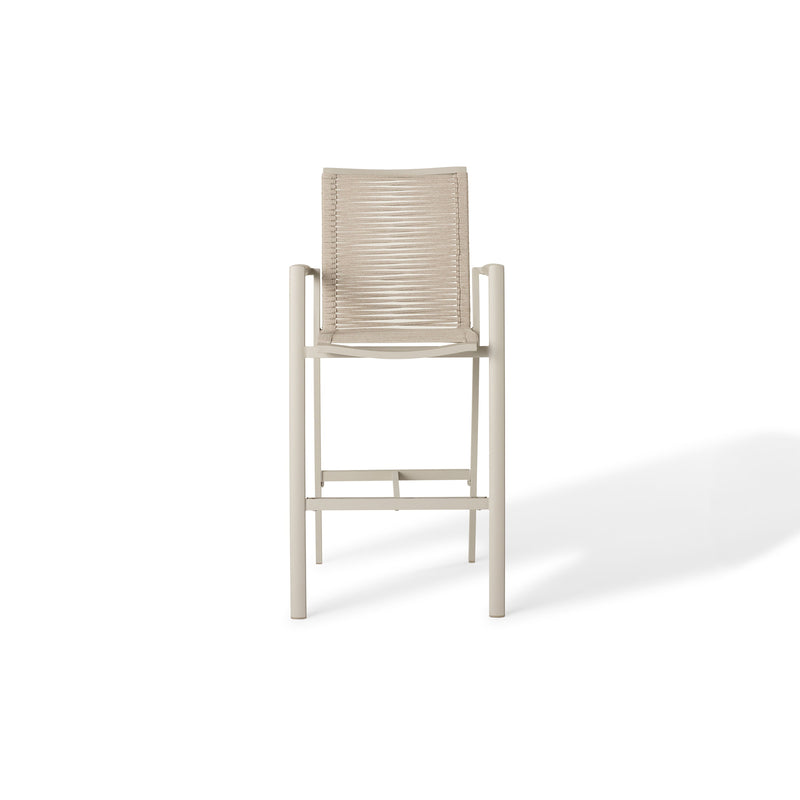 The Diablo Bar Chair in Dune by Terra Outdoor Living features squared off clean lines and rope wrapping for the seat and back. It has straight arms, a foot rest, and a cross bar for structural strength. Seat and back are subtly scooped for ergonomics.