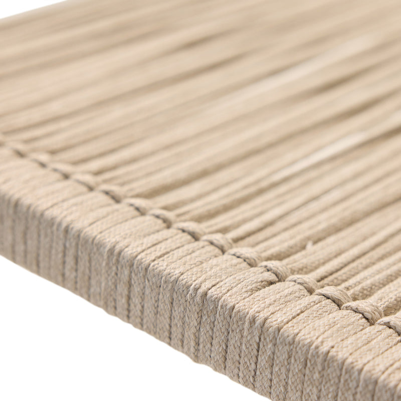 The Diablo Bar Chair in Dune by Terra Outdoor Living features squared off clean lines and rope wrapping for the seat and back. It has straight arms, a foot rest, and a cross bar for structural strength. Seat and back are subtly scooped for ergonomics. Close up shows texture of the rope.
